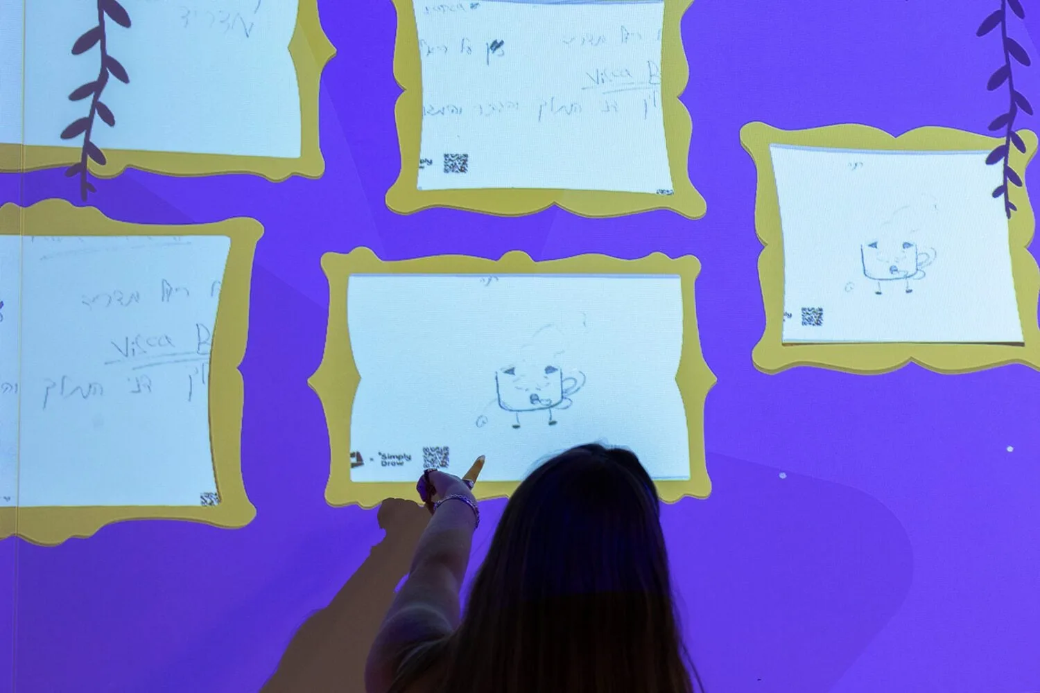 A child drawing at a museum station
