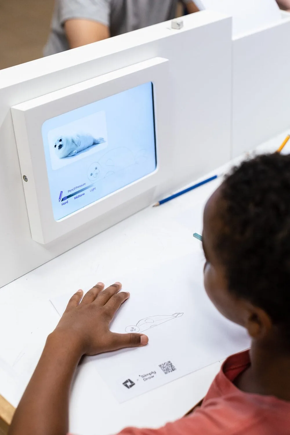 A visitor using a Simply Draw station at the Tel Aviv Museum of Art