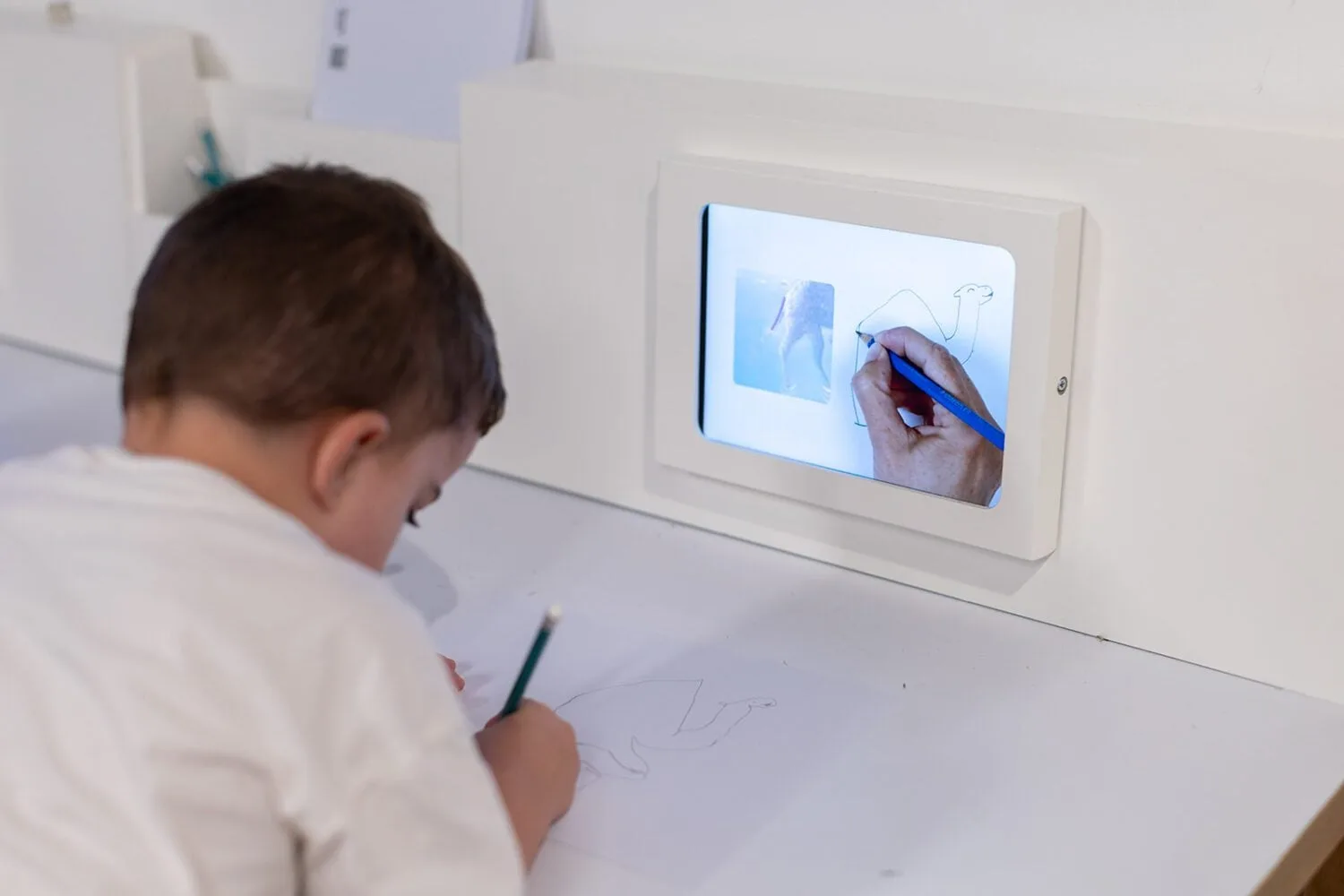 Visitors drawing at the Simply Draw stations in the Tel Aviv Museum of Art